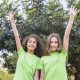 portrait-smiling-girl-raising-their-arm-standing-front-trees portrait-smiling-girl-raising-their-arm-standing-front-trees